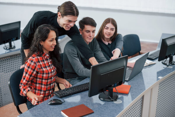 Everything will be awesome. Group of young people in casual clothes working in the modern office, Nutanix certification