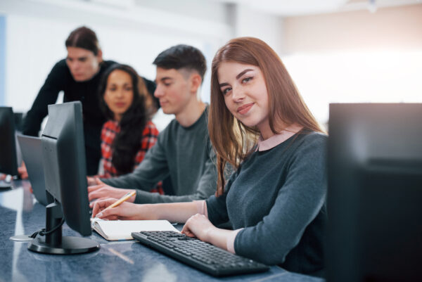 Pretty girl. Group of young people in casual clothes working in the modern office, Instructor-Led Training