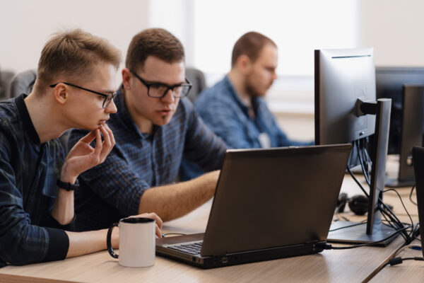 Group of men looking at the laptop, Instructor-Led Training